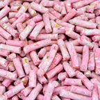 Pink suet pellets with sprinkles on a pink background