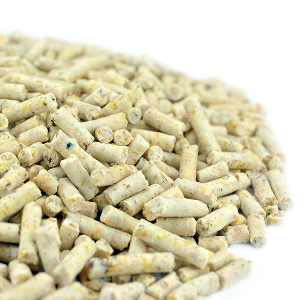 Pile of small, cylindrical white pellets on a white background