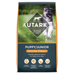 Autarky Puppy/Junior dog food package with a dog on a grass background