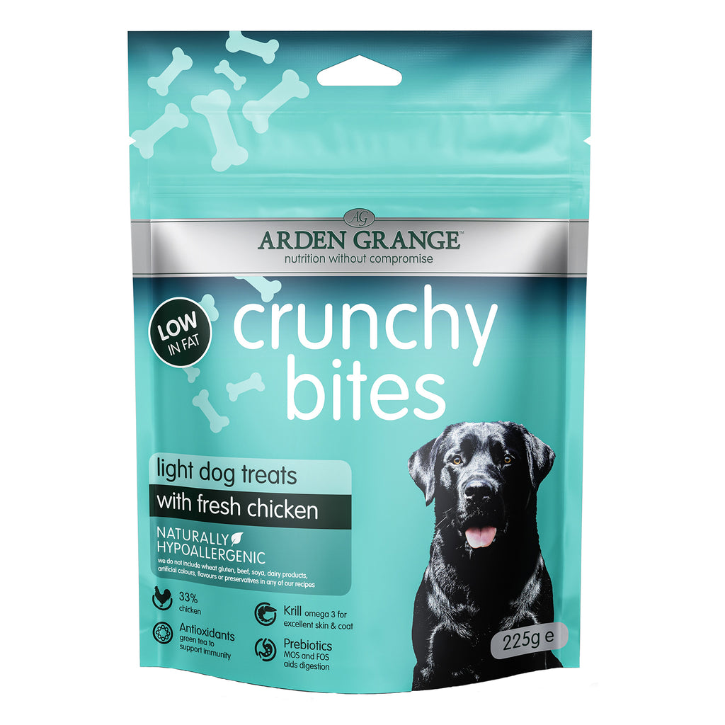 A 225g stand-up pouch of Arden Grange Crunchy Bites light dog treats with fresh chicken. The packaging is teal with white text and bone graphics, featuring a black Labrador dog on the front.