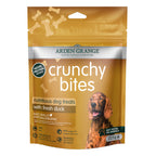 A bag of Arden Grange Crunchy Bites duck dog treats with fresh duck, featuring a golden-brown design with a photo of a brown dog on the front.