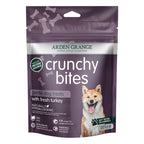 Package of Arden Grange crunchy bites turkey dog treats with a purple background
