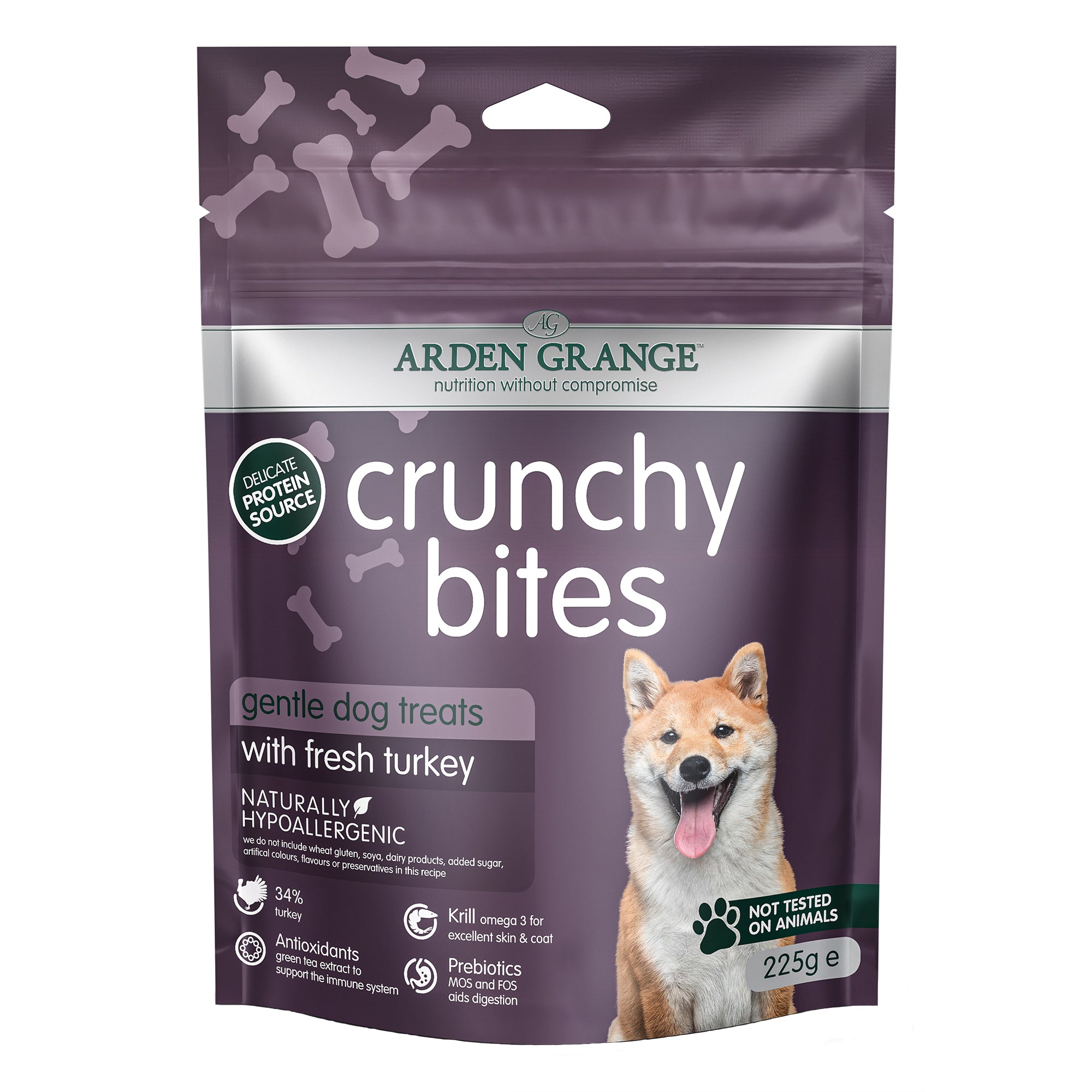 Package of Arden Grange crunchy bites turkey dog treats with a purple background