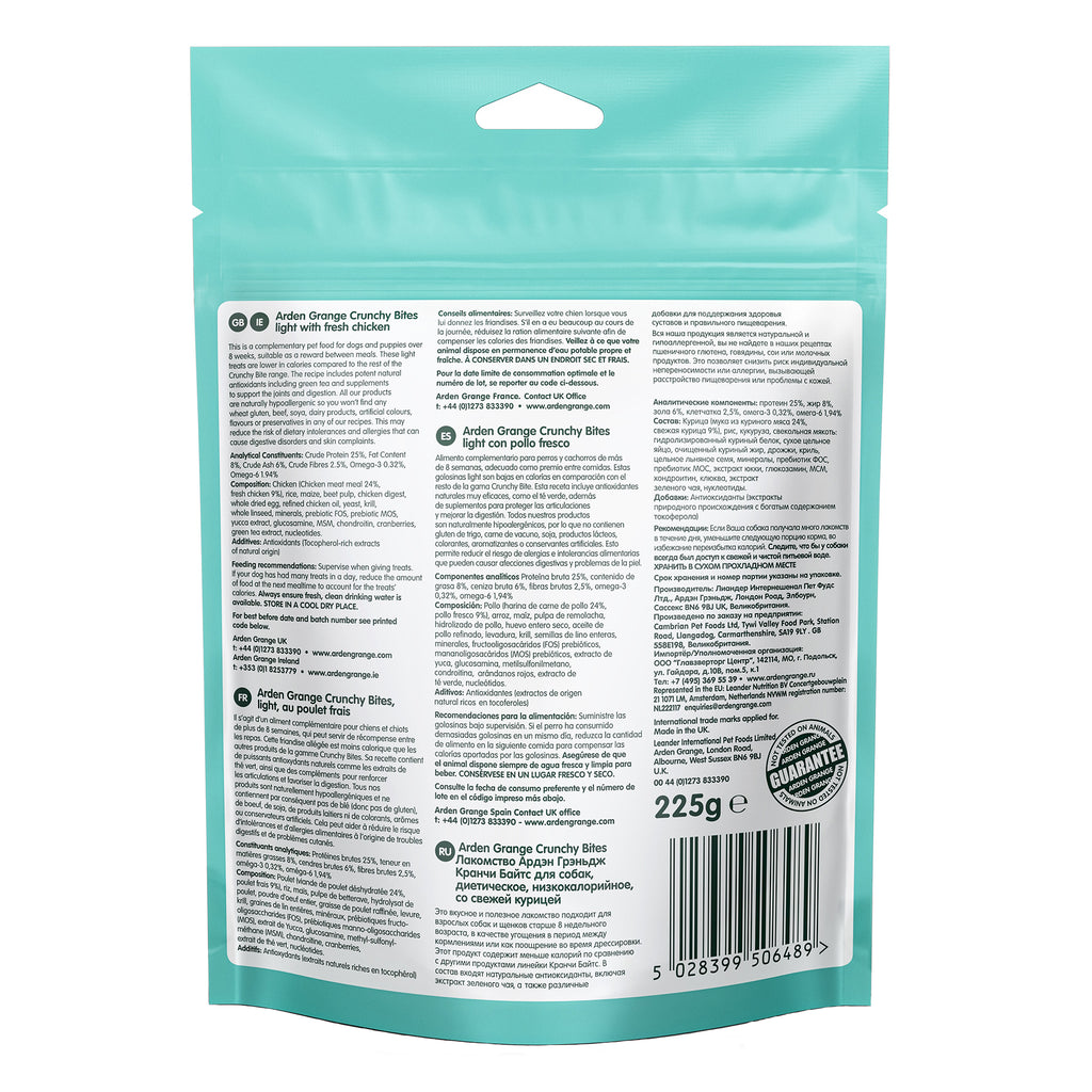 Back view of a teal stand-up pouch package for Arden Grange Light Crunchy dog treats, showing detailed ingredient and instruction text on a white panel with a barcode and weight of 225g.