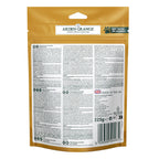 Back of a Arden Grange crunchy duck dog treats pet food pouch in a metallic gold color, showing detailed product information, ingredients, and a barcode on a white background.
