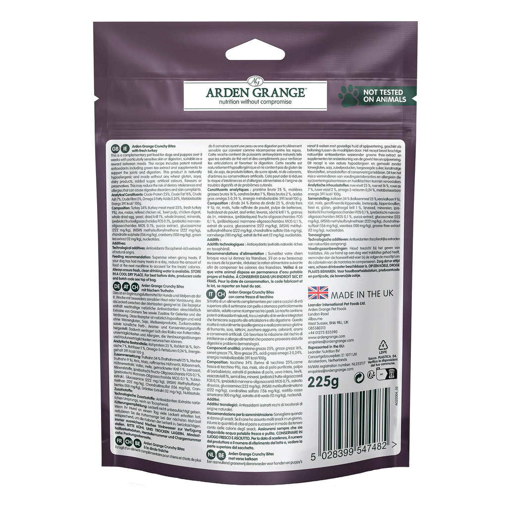 Back of a 225g pouch of Arden Grange crunchy bites turkey Nutritian Without Compromise dog food, featuring extensive text, a barcode, and a green 'Not Tested on Animals' badge on a white background. 