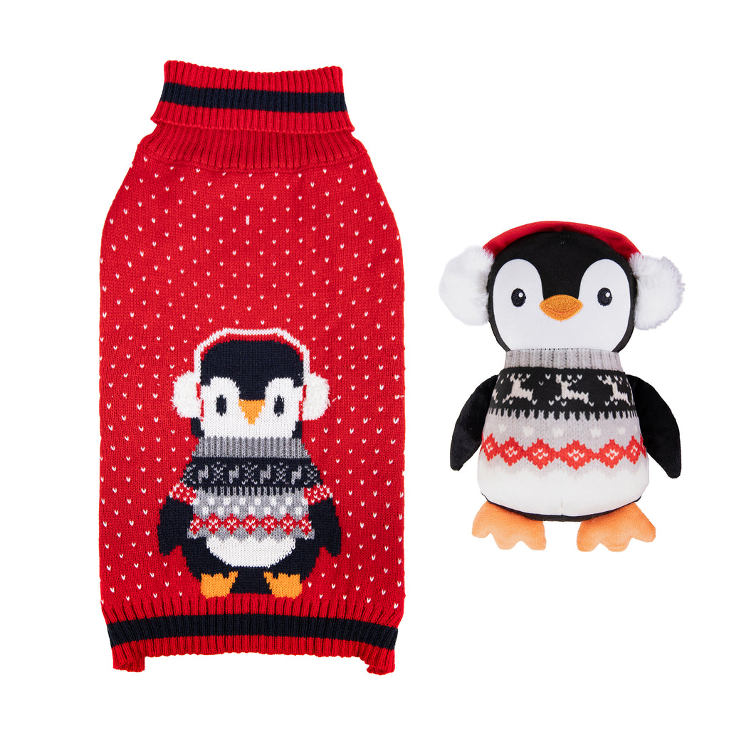 Rosewood Cupid & Comet red Christmas dog jumper with penguin design beside a plush penguin toy
