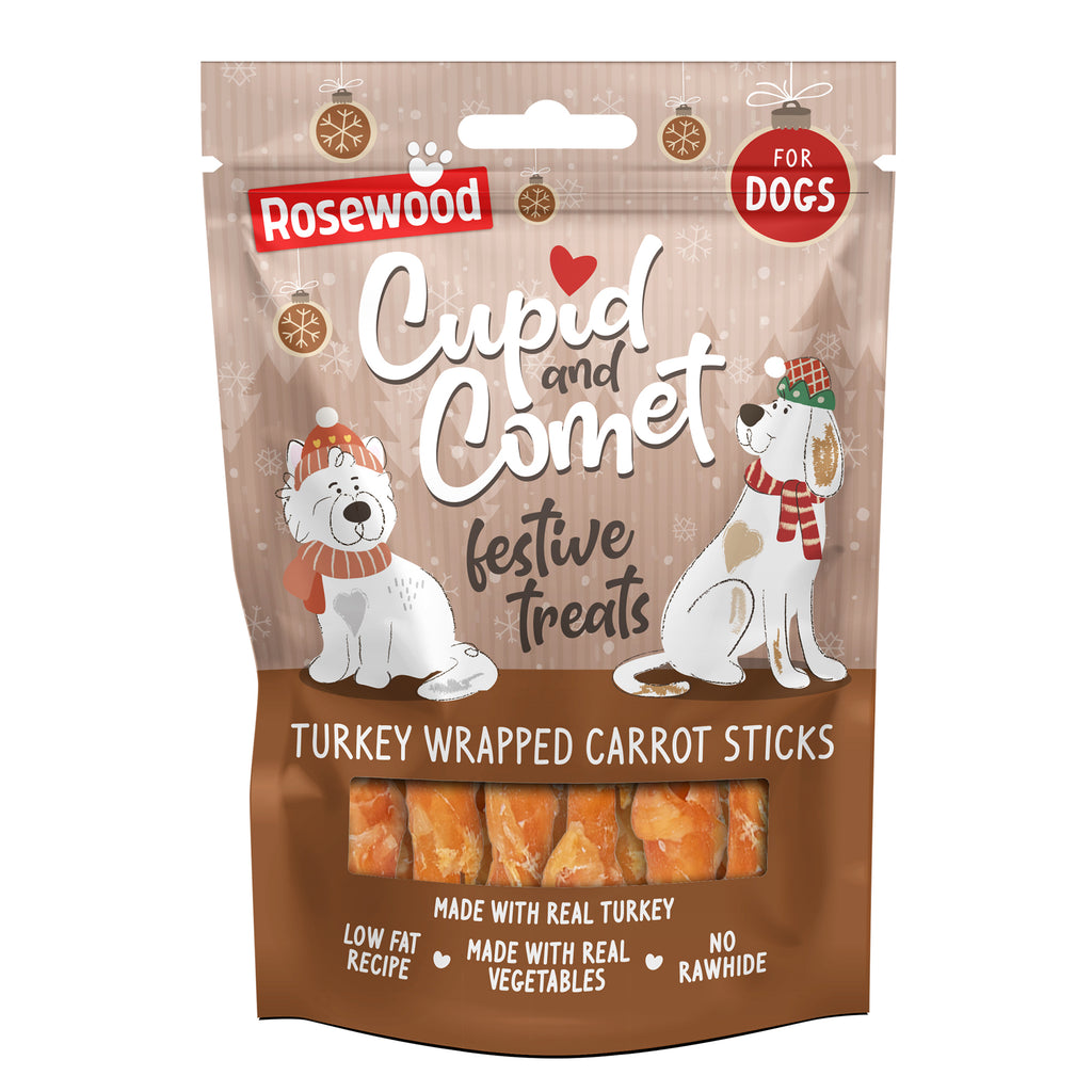 Rosewood Cupid & Comet Turkey Wrapped Carrot Sticks 100g — festive brown packaging with two illustrated dogs wearing Christmas hats and scarves, showing turkey wrapped carrot sticks through a window at the bottom