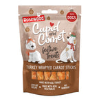 Rosewood Cupid & Comet Turkey Wrapped Carrot Sticks 100g — festive brown packaging with two illustrated dogs wearing Christmas hats and scarves, showing turkey wrapped carrot sticks through a window at the bottom